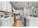 Modern kitchen with white cabinets, stainless steel appliances, and a spacious center island at 1513 Thin Pine Dr, Johns Island, SC 29455