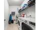 Functional laundry room with modern washer and dryer units, and ample storage at 1513 Thin Pine Dr, Johns Island, SC 29455