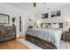 Bright main bedroom featuring wood furnishings, neutral walls, and an ensuite bathroom with a walk-in closet at 1513 Thin Pine Dr, Johns Island, SC 29455