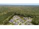 A beautiful aerial view of a neighborhood surrounded by green trees and landscaping at 154 Boots Branch Rd, Summerville, SC 29485