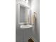 A clean powder room features a pedestal sink, a simple mirror, and classic fixtures at 154 Boots Branch Rd, Summerville, SC 29485