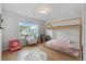 Cozy bedroom with hardwood floors, a charming bed frame, a round rug, and natural light at 154 Boots Branch Rd, Summerville, SC 29485