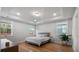 Bright bedroom with tray ceiling, hardwood floors, and multiple windows offering plenty of sunlight at 154 Boots Branch Rd, Summerville, SC 29485