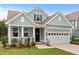 Charming single-Gathering home with a manicured lawn, inviting porch, and an attached two-car garage at 154 Boots Branch Rd, Summerville, SC 29485