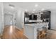 Bright kitchen features a large island, stainless steel appliances, and stylish dark gray cabinetry at 154 Boots Branch Rd, Summerville, SC 29485