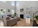 Inviting living room featuring wood flooring, a fireplace, and an abundance of natural light at 154 Boots Branch Rd, Summerville, SC 29485