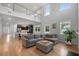 Open concept living room with tall ceilings, wood floors, and modern decor at 154 Boots Branch Rd, Summerville, SC 29485