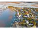Beautiful aerial view displays waterfront homes nestled amidst lush greenery and scenic lake views, showcasing coastal living at 1614 Teal Marsh Rd, Charleston, SC 29412
