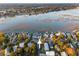 Aerial view of waterfront homes displaying stunning lake views and community layout near the shoreline at 1614 Teal Marsh Rd, Charleston, SC 29412