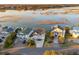 Aerial view showcases waterfront property with lush landscaping and serene lake views, creating a private oasis at 1614 Teal Marsh Rd, Charleston, SC 29412