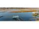 Tranquil waterfront backyard with a private dock and lush marsh views at 1614 Teal Marsh Rd, Charleston, SC 29412