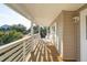Relaxing covered balcony with a swing offers scenic outdoor views and comfortable seating, enhancing leisure at 1614 Teal Marsh Rd, Charleston, SC 29412