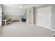 Spacious bonus room offers a neutral palette, large closet, desk, and plush carpeting at 1614 Teal Marsh Rd, Charleston, SC 29412
