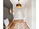Inviting foyer with hardwood floors, stylish lighting, and a decorative mirror at 1614 Teal Marsh Rd, Charleston, SC 29412