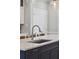 Close-up on a spacious kitchen island with stainless sink, modern faucet, and dark gray cabinets at 1614 Teal Marsh Rd, Charleston, SC 29412
