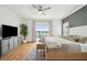 Spacious bedroom boasts deck access, ample natural light, and modern decor at 1614 Teal Marsh Rd, Charleston, SC 29412