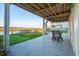 Covered patio, offers outdoor living space, with a putting green and waterfront views at 1614 Teal Marsh Rd, Charleston, SC 29412