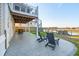 Outdoor patio featuring spiral stairs to an upper deck and views of the private dock at 1614 Teal Marsh Rd, Charleston, SC 29412