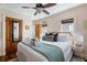 Bright bedroom with a ceiling fan, wood floors, and natural light streaming through the windows at 162 Spring St # A, Charleston, SC 29403