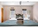 Sun-filled bedroom featuring a large bed with comfortable pillows and a cozy blanket at 162 Spring St # A, Charleston, SC 29403