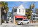 Charming two-story home with a red awning and a parking spot in front at 162 Spring St # A, Charleston, SC 29403
