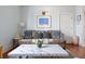 Comfortable living room showcasing a leather sofa, marble coffee table, and charming decor at 162 Spring St # A, Charleston, SC 29403