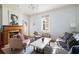 Cozy living room featuring a fireplace, comfortable seating, and ample natural light at 162 Spring St # A, Charleston, SC 29403