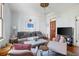 Bright living room featuring stylish furnishings, hardwood floors, and elegant lighting fixture at 162 Spring St # A, Charleston, SC 29403