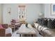 Inviting living room with plush seating, natural light, and a decorative marble coffee table at 162 Spring St # A, Charleston, SC 29403