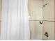 Clean shower with tiled walls, featuring a shower head and toiletries at 162 Spring St # A, Charleston, SC 29403