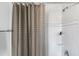 Bathroom features a shower with white subway tiles and modern fixtures at 162 Spring St # D, Charleston, SC 29403