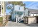 Charming light blue two-story home with inviting front porch and well-maintained yard and gravel drive at 162 Spring St # D, Charleston, SC 29403