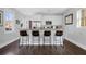 Modern kitchen with sleek countertops and four bar stools, perfect for casual dining at 162 Spring St # D, Charleston, SC 29403