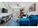 Comfortable living room with a blue sectional couch, flat screen tv and natural light at 162 Spring St # D, Charleston, SC 29403