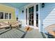 Inviting front porch featuring comfortable seating, perfect for relaxing and enjoying the outdoors at 162 Spring St # D, Charleston, SC 29403