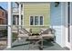 Relaxing porch setup with cozy chairs and a table, creating a comfortable outdoor space at 162 Spring St # D, Charleston, SC 29403