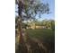 View of a home from the backyard, set amidst large trees providing shade and privacy at 1633 Southwick Dr, Johns Island, SC 29455