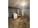 Basement utility area with a washer, water heater, and concrete floor, catering to laundry needs at 1633 Southwick Dr, Johns Island, SC 29455