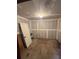 Unfinished basement room with bare drywall, cement floor, and door, ready for customization at 1633 Southwick Dr, Johns Island, SC 29455
