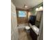 Bathroom featuring a granite countertop vanity and a shower-tub combo at 1633 Southwick Dr, Johns Island, SC 29455