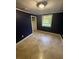 A blue bedroom featuring tile floors, closet and a window at 1633 Southwick Dr, Johns Island, SC 29455