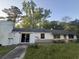 Modest ranch-style home with a partially overgrown yard and cinderblock construction at 1633 Southwick Dr, Johns Island, SC 29455