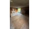 Downstairs living room area with a brick fireplace and sliding glass doors at 1633 Southwick Dr, Johns Island, SC 29455