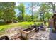 Large backyard offers a lovely patio, comfortable seating and a fire pit at 1637 Pinckney Park Dr, Charleston, SC 29407