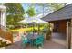 Backyard patio includes outdoor table and chairs, grill, and raised planter beds at 1637 Pinckney Park Dr, Charleston, SC 29407