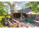 Backyard boasts a patio with a dining area, grill, and additional seating at 1637 Pinckney Park Dr, Charleston, SC 29407