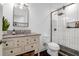 Charming bathroom featuring a marble vanity, a tiled shower, and sleek fixtures at 1637 Pinckney Park Dr, Charleston, SC 29407