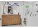 Bright bathroom features a double vanity, a large mirror, and a frameless shower at 1637 Pinckney Park Dr, Charleston, SC 29407