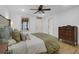 Bright bedroom features light hardwood floors, soft bedding, and natural light at 1637 Pinckney Park Dr, Charleston, SC 29407