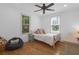 Bright bedroom featuring hardwood floors, natural light, and a cozy beanbag chair at 1637 Pinckney Park Dr, Charleston, SC 29407